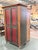 Solid wood media armoire designed by RomWeber featuring a classic cabinet form with paneled doors and turned feet. The...