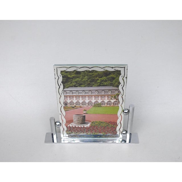 A large and elegant picture frame from the time of Art Deco from France. It shows the typical strict design language of...