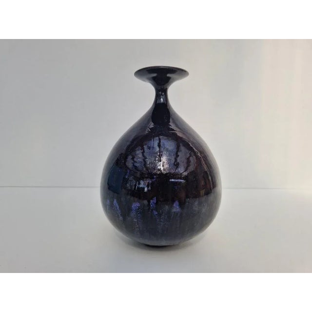 Ceramic object by Dorothee Colberg-Tjadens, manufactured in the 1980s. Dark blue running glaze. This piece has an...