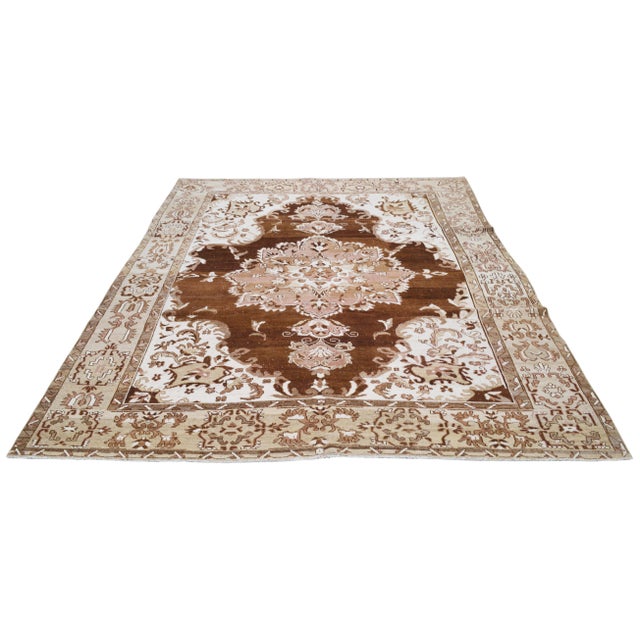 Hand-knotted with care using traditional rug-making techniques, this wool rug blends timeless craftsmanship with a modern...