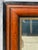 Striking oversized full-length mirror with a richly distressed, warm amber-brown wood frame, abundant natural-looking...