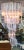 Beautiful Italian style spiraled Lucite chandelier from the mid 20th century. The piece is made of Lucite prisms that hang...