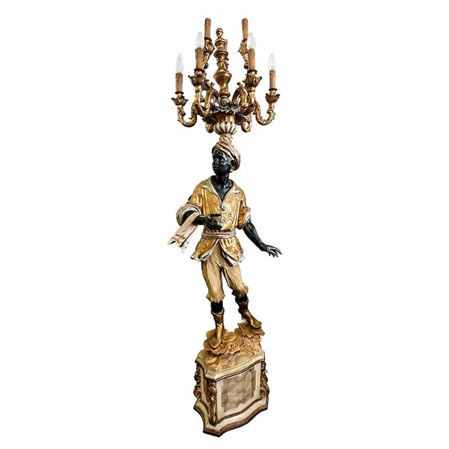 A striking and refined floor lamp with a striking decorative effect, crafted from a precious venetian moretto figure,...