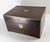 We are selling this nice English Rosewood veneered Vanity Case. This box has nice form with brass corners and a hidden...
