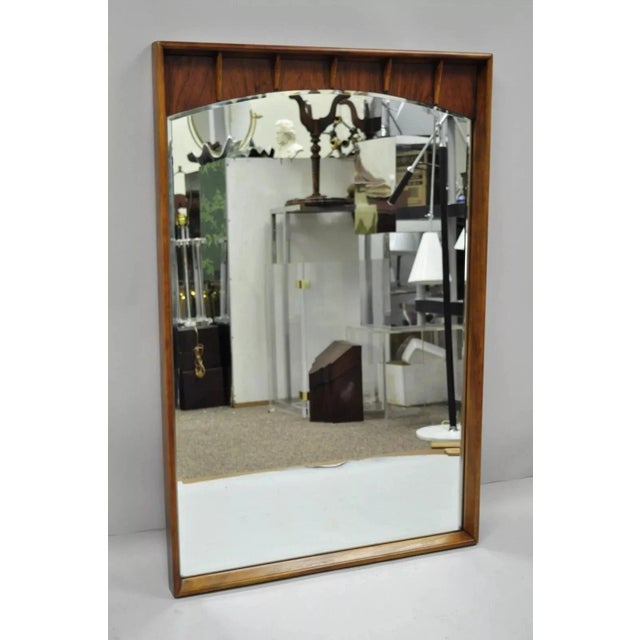 Vintage Mid Century Modern Sculpted Walnut & Rosewood Beveled Glass Wall Mirror attributed to Lane. Item features solid...