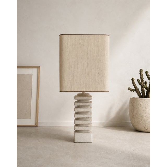 Large sculptural French lamp dating from circa 1970. The graphic limestone base is formed by a rhythmic arrangement of...