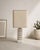 Large sculptural French lamp dating from circa 1970. The graphic limestone base is formed by a rhythmic arrangement of...