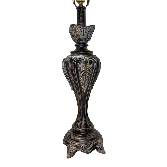 Ornate vintage cast-metal table lamp with acanthus scrollwork (32 in tall); powers on but sold without a shade and shows a...