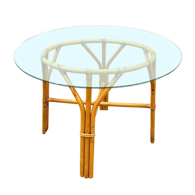 This beautifully restored round Frankl-inspired round rattan dining table features a sculptural 3-strand rattan base with...