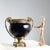 Cobalt blue porcelain and gilt bronze centerpiece. Square base with studs and garland, handles decorated with leafy...