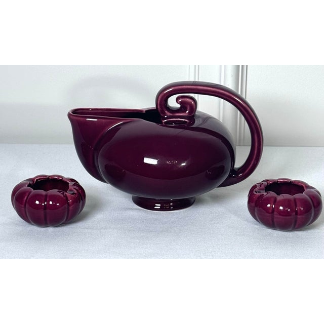 This is an American art pottery vintage "alladin or pelican" tilt tea pot. Featuring an aerodynamic streamline body, a...