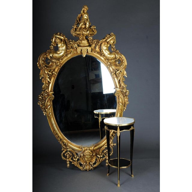 Royal and monumental gilded wall mirror model after Francois Linke, Paris. Ornate rococo mirror, solid wood gilded, Paris,...
