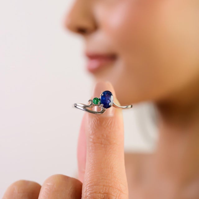 This stunning Modern Blue Sapphire & Emerald Two-Stone Promise Ring is crafted in high-quality 925 sterling silver,...