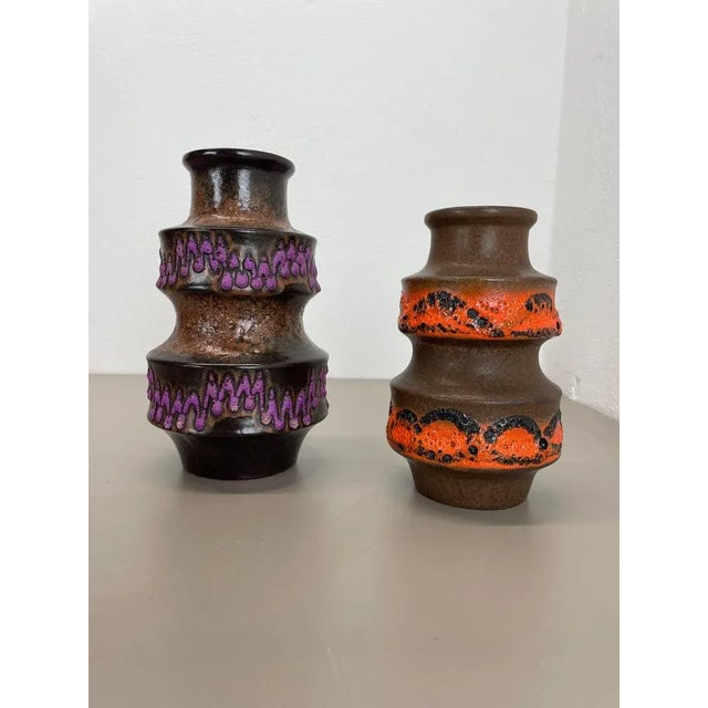 Article: Set of two fat lava art vases Producer: Scheurich, Germany Decade: 1970s These original WGP vintage vases were...