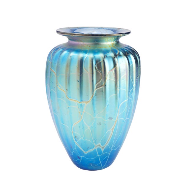 An iridescent blown glass vase by Manhattan Beach, California glass artist Mayauel Ward. The vase features a tapered and...