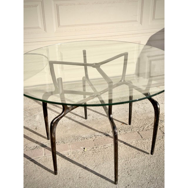 Sculptural Antique Bronzed Iron Legs Round 48” Glass Top Cyrano Dining Table by Made Goods For Sale - Image 10 of 11