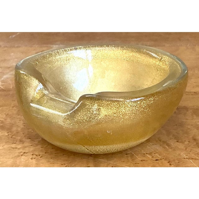Exuding Venetian glamour and mid-century elegance, this vintage Murano hand-blown glass bowl showcases the famed Italian...