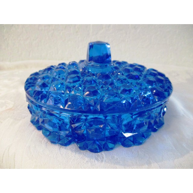 Gorgeous mid-century clear cut to clear glass lidded divided bowl in a stunning shade of lazer blue. When glass catches...