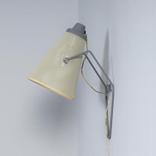 Rare vintage perfolux wall lamp by hiemstra & evenblij. This mid-century wall lamp stands out for its perforated shade,...