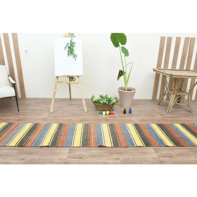 Vintage Turkish Hand-Knotted vintage rug is a semi-antique vintage runner rug. The '70s Eastern region of Turkey's unique...