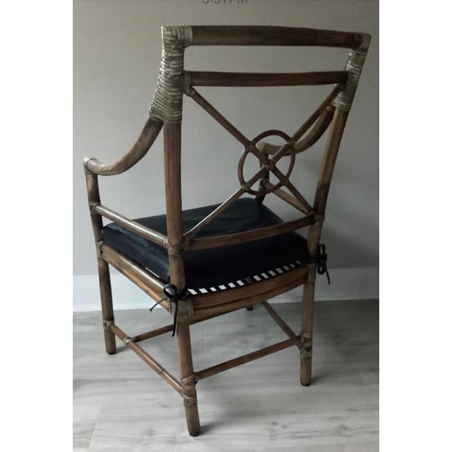 Authentic Vintage McGuire Target Rattan and Rawhide Armchair with leather seat, featuring Mc Guire’s beautifully crafter...