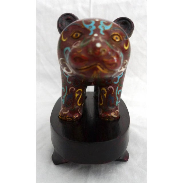 Offered is a Chinese Cloisonne Bear figurine with fitted wood stand. The figurine is ornamented with a multicolor archaic...