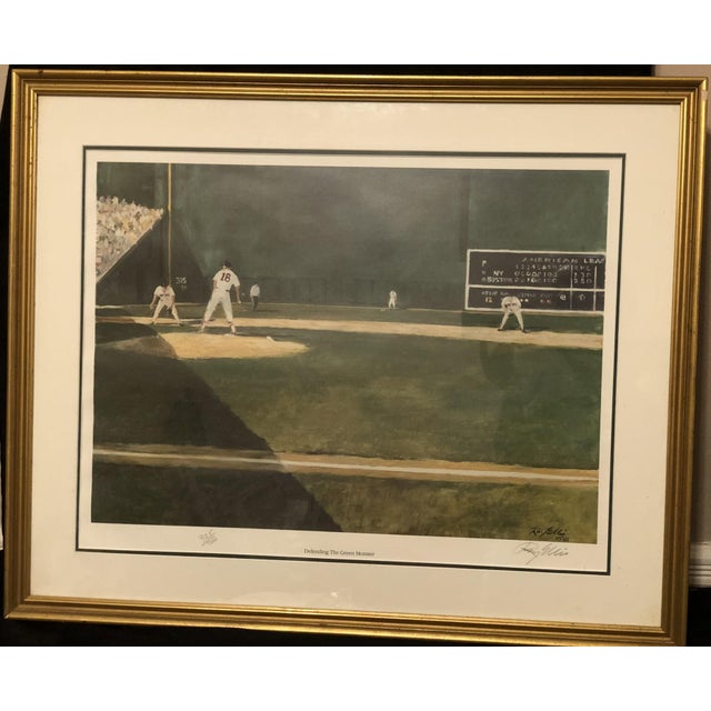 "Defending The Green Monster" is a captivating 1986 limited-edition print by renowned American realist artist Ray Ellis...