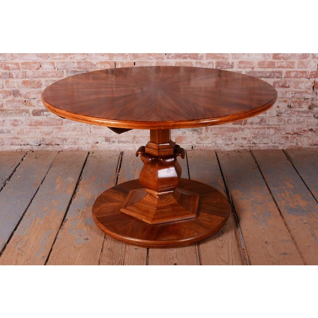 This dining table with a tilt-top surface is a brilliant example of Austrian furniture making from the early 19th-century...