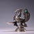 This is an ornate, silver-plated copper oil lamp or figural vessel in the form of a stylized phoenix or mythical bird. The...