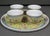 A charming vintage Chinese tea serving set in the classic Mun Shou longevity pattern, featuring four porcelain cups and a...