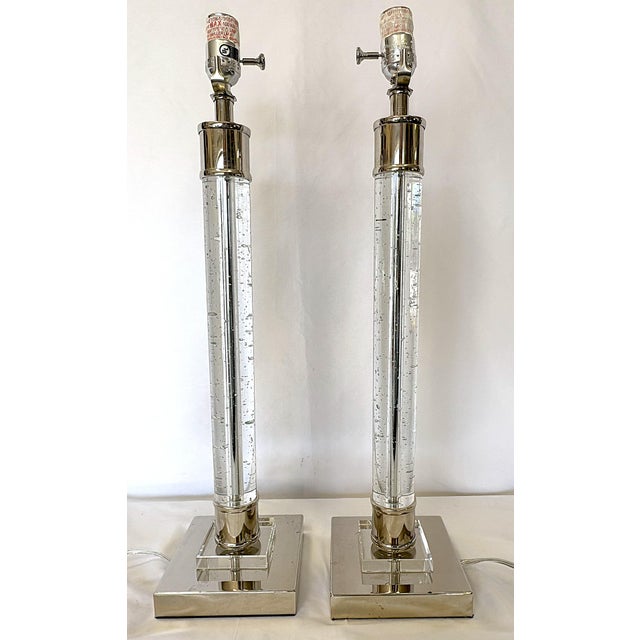 Great pair of crystal and chrome column lamps. They are on a three-way switch and can light just the top bulb, or just the...