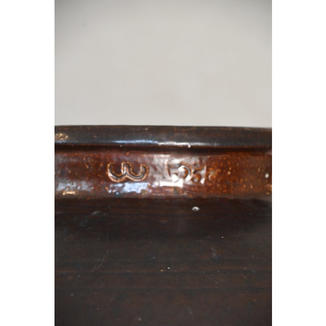 Early 20th century antique earthenware vessel with a rich chocolate-brown glaze were once used for everyday storage. Now...