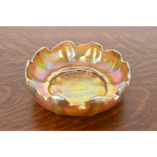 A gorgeous Arts & Crafts or Art Nouveau period Favrile iridescent art glass scalloped bowl By Louis Comfort Tiffany for...