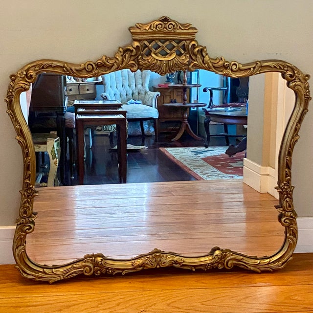 Beautiful statement wall mirror! Ad a touch of French flair to your home with this gold tone finish mirror with a crown...