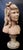 This wonderful vintage early 20th century terra cotta sculpture is of the head of a young girl with a ribbon in her curled...