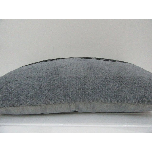 This is a pillow cover made from a vintage kilim rug. The piece was properly washed and ready to use. Pillow inserts not...