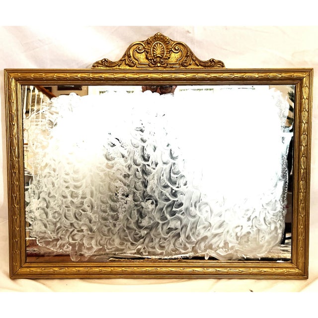 Because the frame of this mirror is carved wood - rather than plaster or gesso - the frame is in excellent condition with...