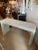 Vintage white wicker, waterfall sides, console table. Original white paint which has a few chippy paint spots. Dimensions:...
