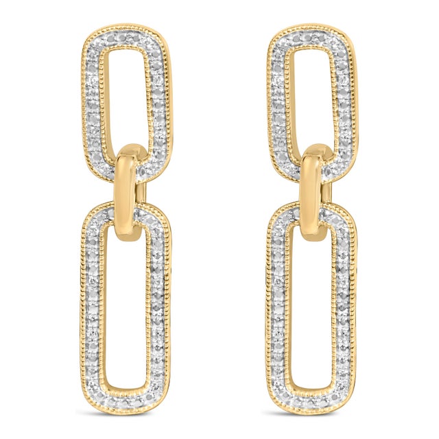 Sleek geometry meets luminous romance in these drop earrings, where two elongated, rounded rectangles sway in graceful...