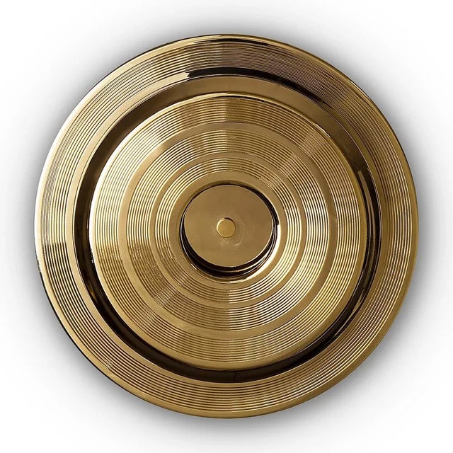 Hendrix wall sconce has a round shape that was inspired by a golden vinyl player. Ideal for every single mid-century...