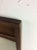 This mid century modern mirror features hardwood frame, original finish, beveled edge and unique walnut inlay at the top....