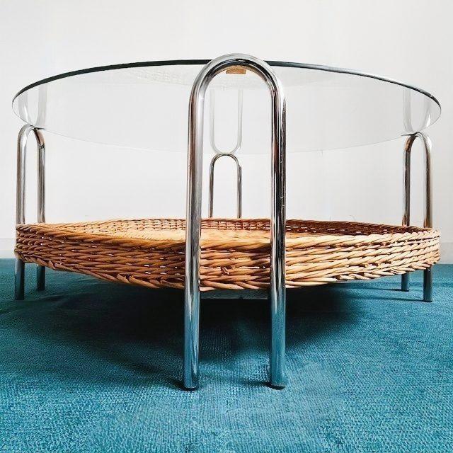 Vintage mid-century retro design coffee table from the 1970s featuring a combination of chrome, glass, and rattan. This...