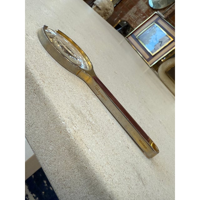 Vintage magnifying glass was produced in Italy during the 1970s and bears the engraved Ferragamo signature along the...