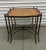 Stunning iron faux bois table features a double curved x-base, double corner faux bois legs, and a beautiful leather...