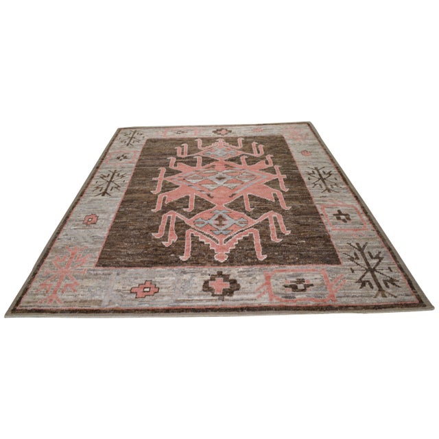 Hand-knotted with care using traditional rug making techniques, this wool rug blends timeless craftsmanship with a modern...