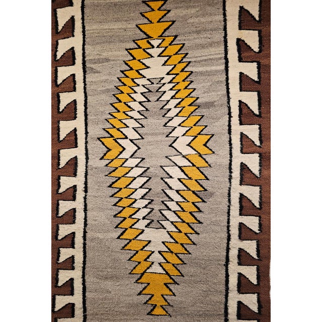 An exceptional example of Native American textile artistry, this vintage Navajo rug from the first half of the 20th...