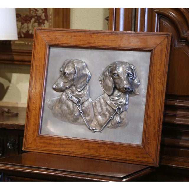 Full of character and remarkable sculptural detail, this antique French wall plaque depicts two hunting dachshunds in an...