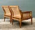 Exude timeless sophistication with this exceptional pair of lounge chairs by the esteemed Baker Furniture company. A...