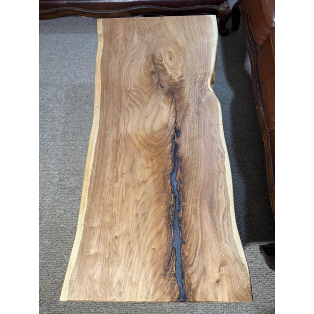 Handcrafted live edge butternut coffee table made from a single solid wood slab. This one of a kind table features natural...