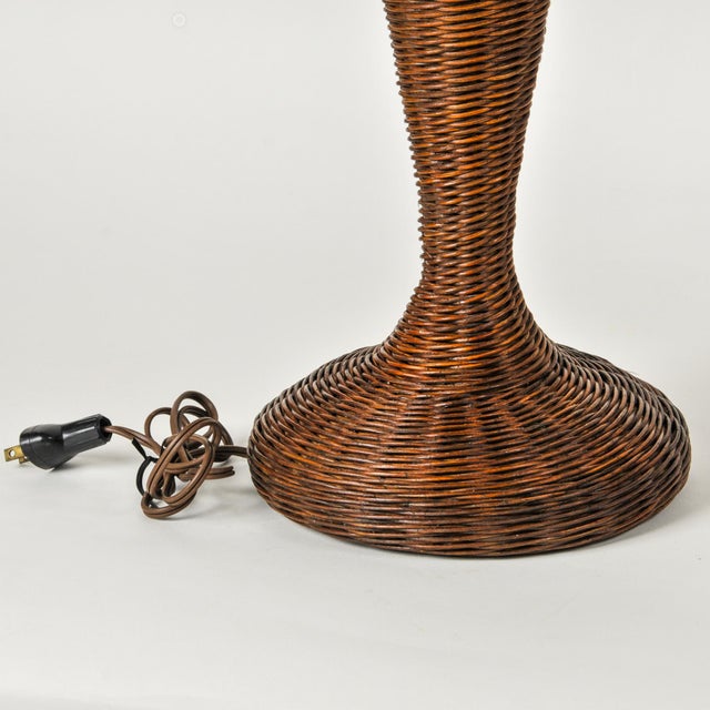 Chocolate brown wicker table lamp with an elegant elongated woven base. Perfect tall vintage statement lamp with natural...